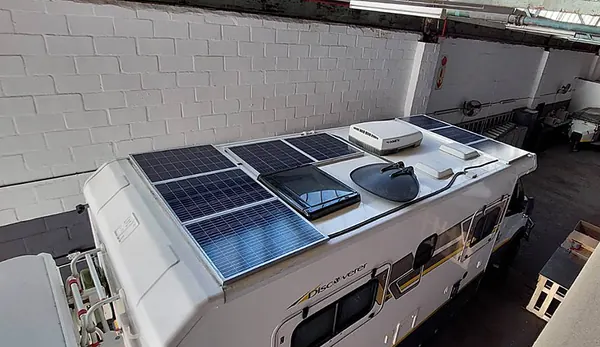 Solar panels fitted to a motorhome roof in the workshop