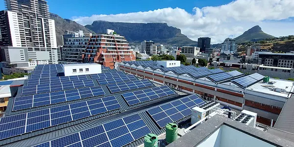 A city rooftop array with Table Mountain and Lion's Head behind