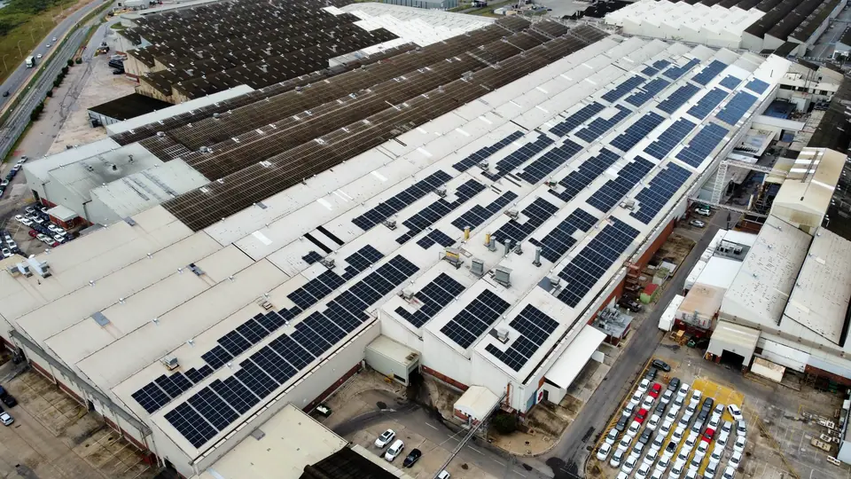 A factory roof with staged rows of panels
