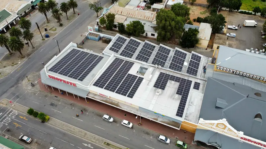 A high-street supermarket roof with panels laid around the skylights
