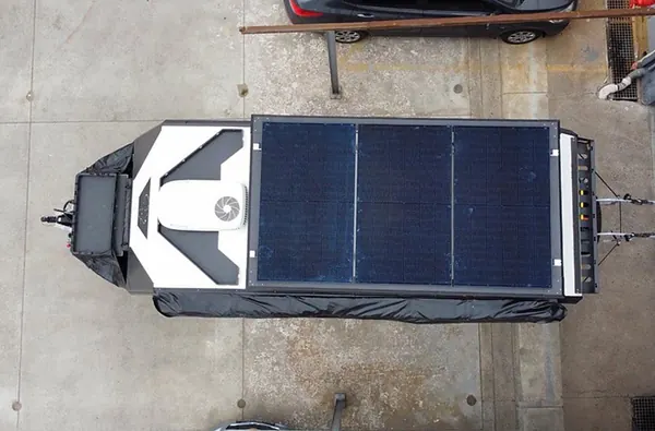 An off-road trailer with a solar panel lid seen from above