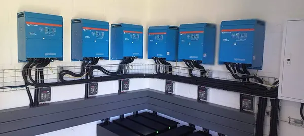 Six Victron inverters in a row on one cable tray